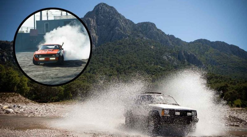 How to drift a Jeep Grand Cherokee 75th Anniversary through rough terrain with water splashes and mountains in the background.